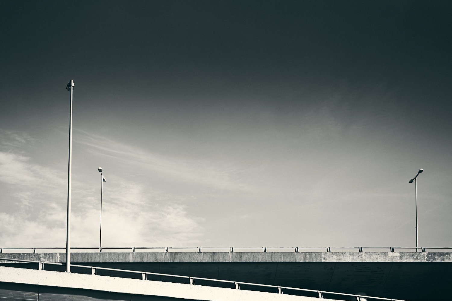 Modern highway bridge in Berlin Wilmersdorf with street lamps and minimalist concrete architecture